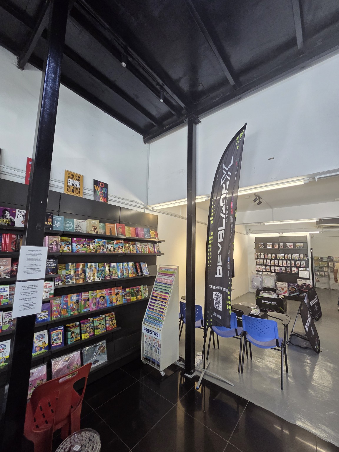 Bookstore shelves and Beyblade activity area